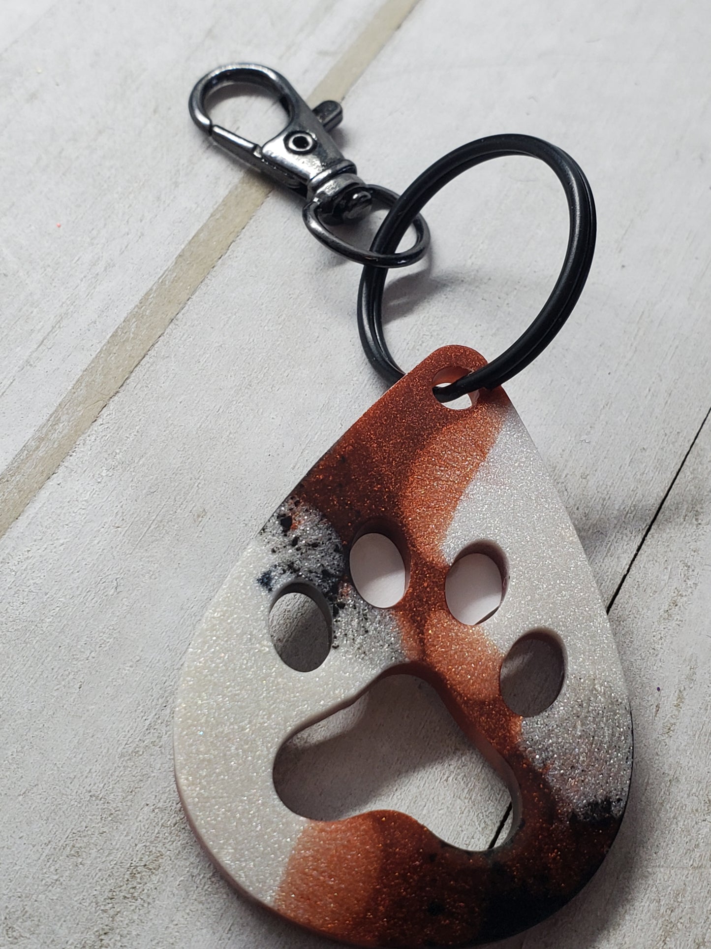 Brown, black, and pearl paw print keychain