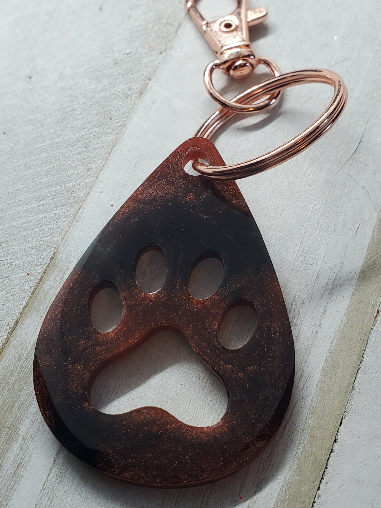 Bronze and black paw print keychain