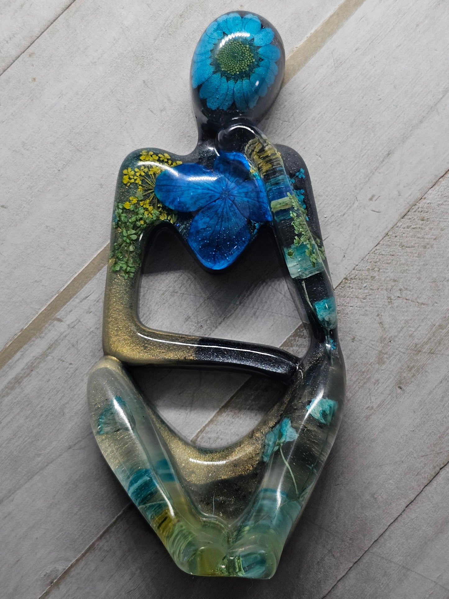 thinker flower figure