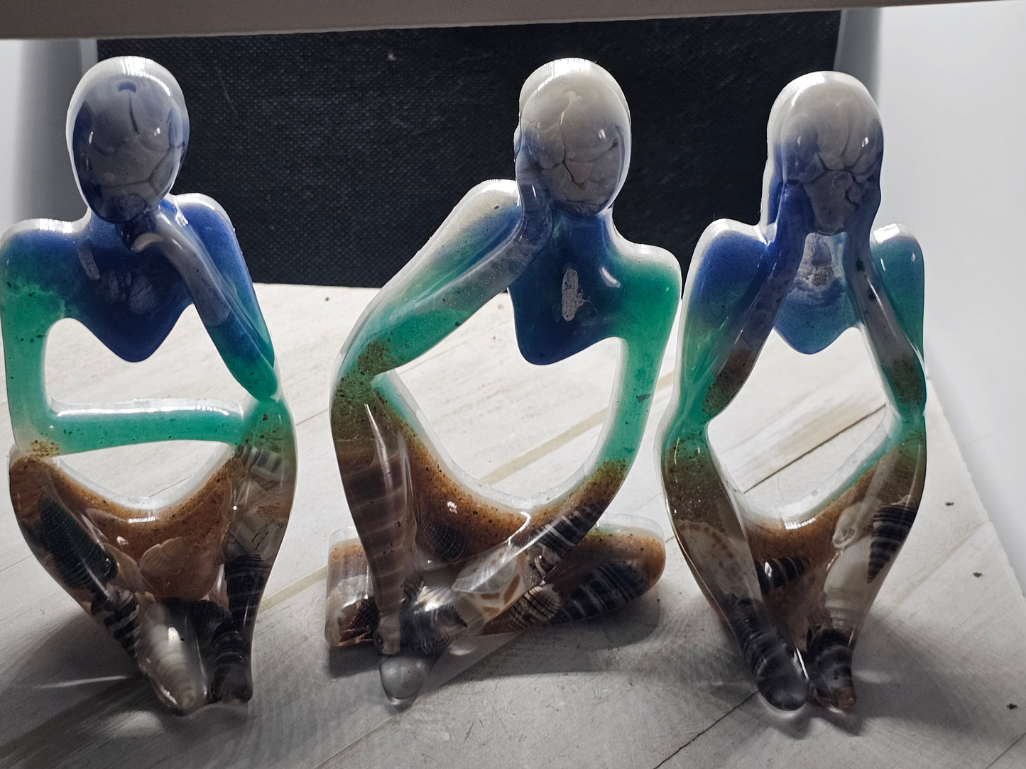 beach thinker resin figurine set
