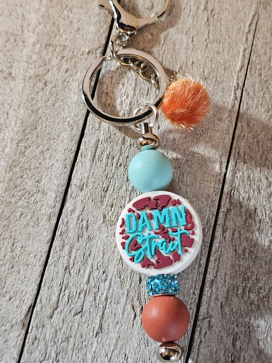 Damn Strait beaded keychain